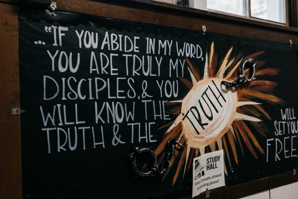 God-Centered blackboard with a verse and a mural.