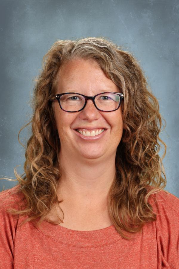 Rachel Kroll, smiling woman with curly hair and glasses.