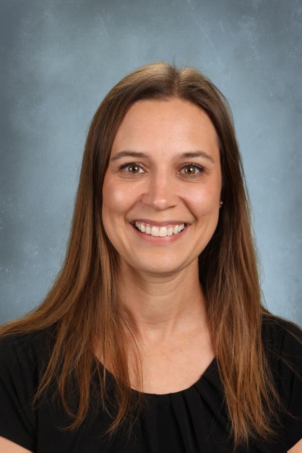 Portrait of a smiling woman with long brown hair