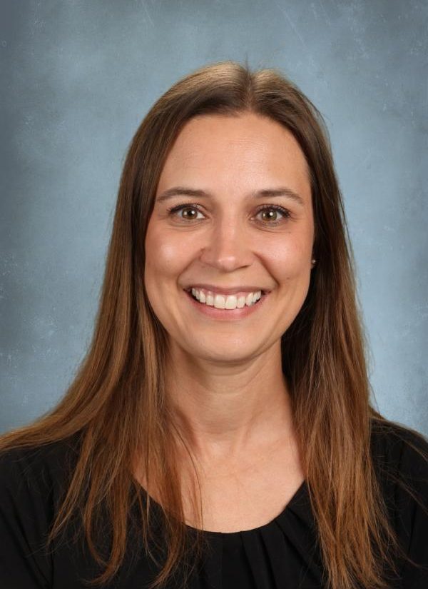 Portrait of a smiling woman with long brown hair