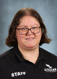 Caulee Christian School staff member wearing a black polo with "STAFF" and school logo.
